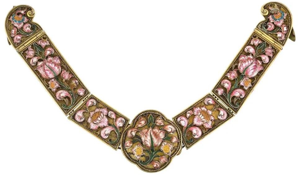Ornate gold and enamel decorative collar with pink floral motifs
